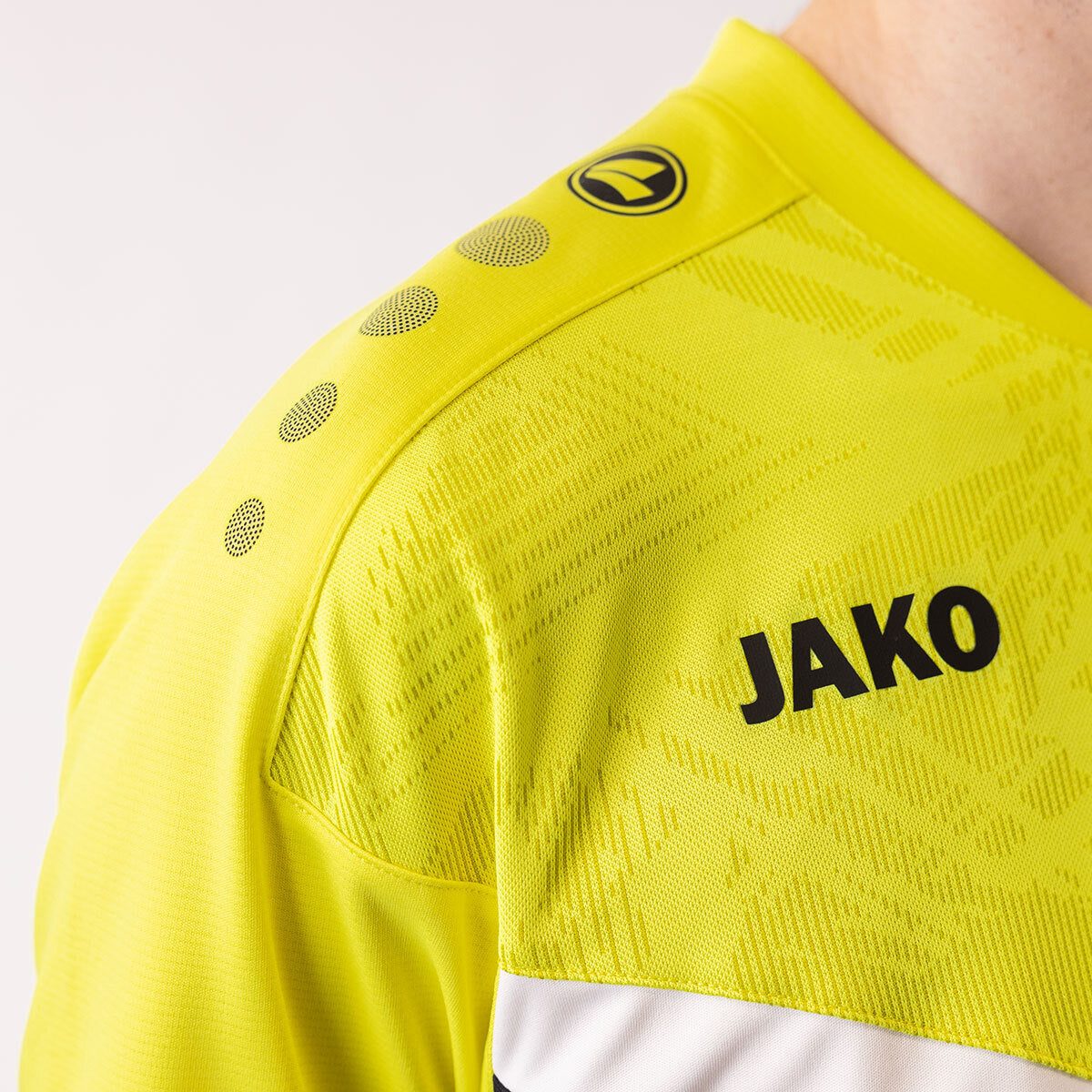 JAKO Polo Iconic 6324 schwarz/soft yellow