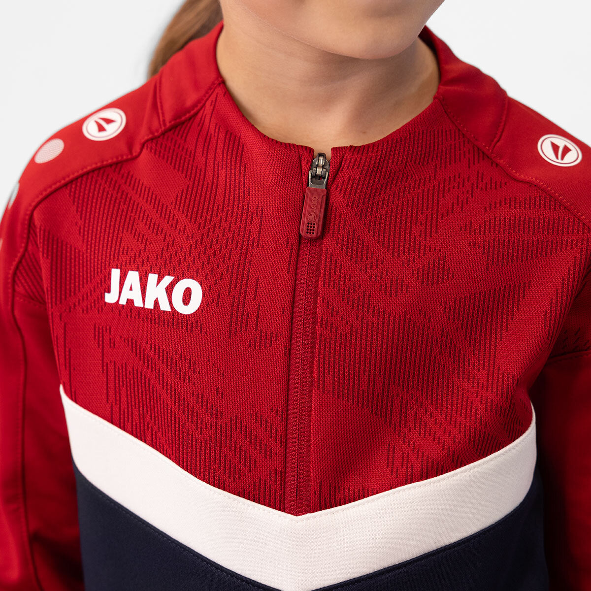 JAKO Ziptop Iconic 8624 marine/chili rot